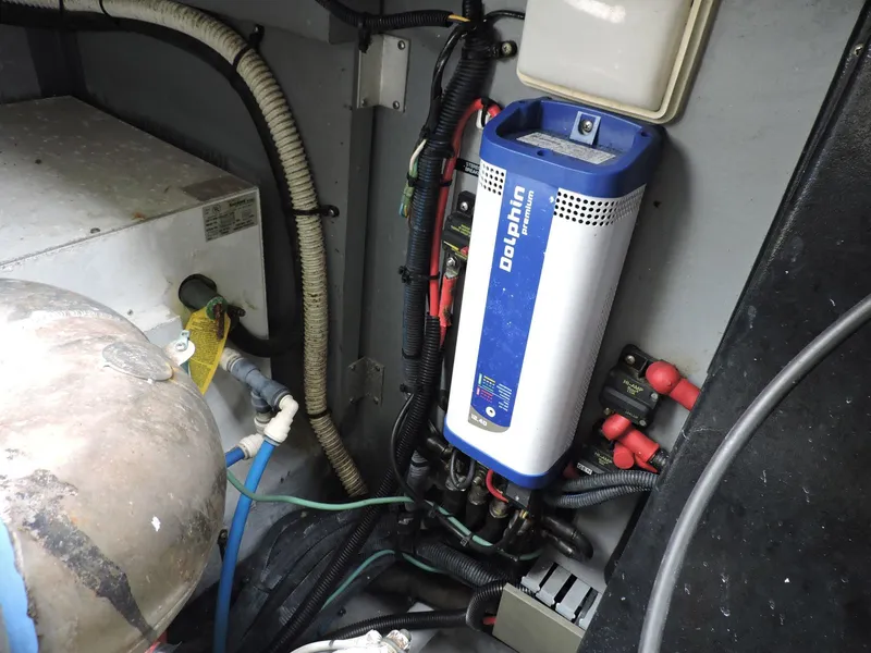 Slide: The Image of Engine compartment of 2002 Sea Ray 410 Sundancer with Dolphin battery charger. - 10