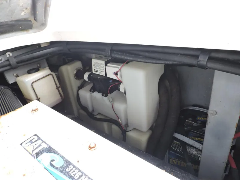 Slide: The Image of Engine compartment of 2002 Sea Ray 410 Sundancer with visible components and wiring. - 11