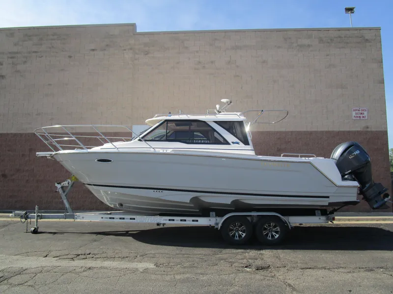 The Image of 2025 Cutwater C-248 Coupe boat on trailer, parked outdoors. - 0