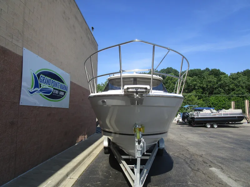 Slide: The Image of 2025 Cutwater C-248 Coupe boat on trailer at Grand Pointe Marina. - 2