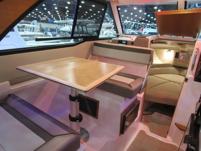 Slide: The Image of Interior of 2025 Cutwater C-248 Coupe, featuring a cozy dining area and modern design. - 20