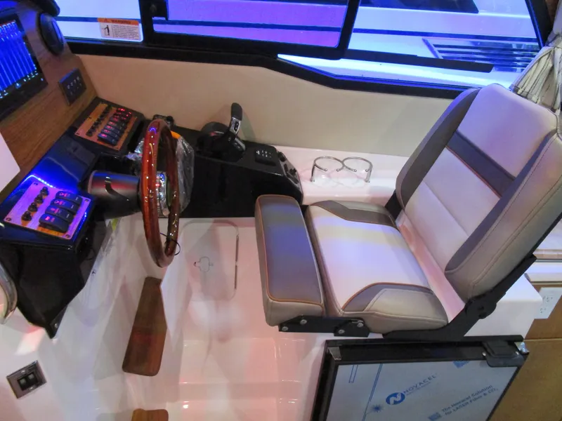 Slide: The Image of 2025 Cutwater C-248 Coupe interior with modern helm and comfortable seating. - 23