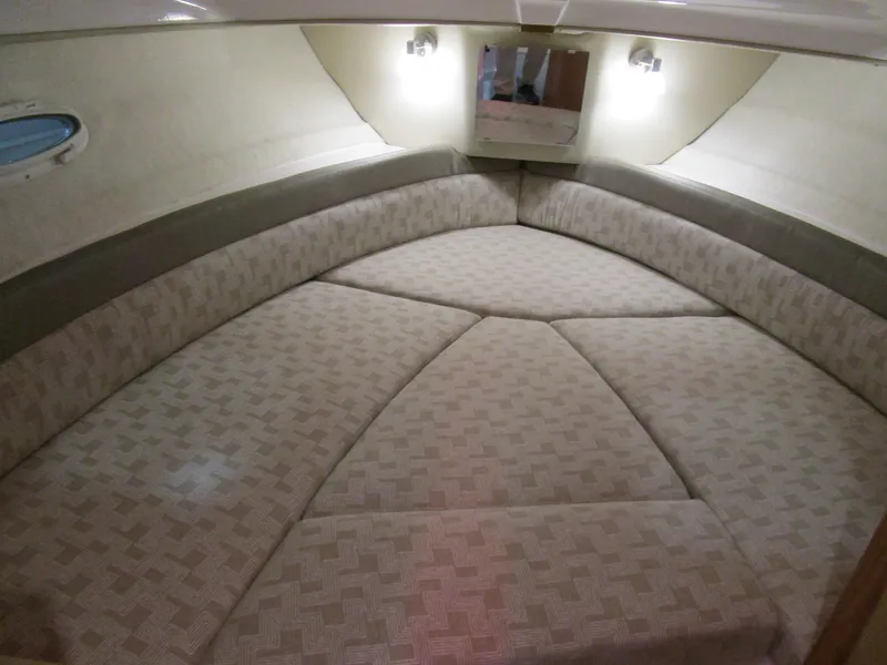 Slide: The Image of 2025 Cutwater C-248 Coupe interior cabin with cushioned seating and ambient lighting. - 28