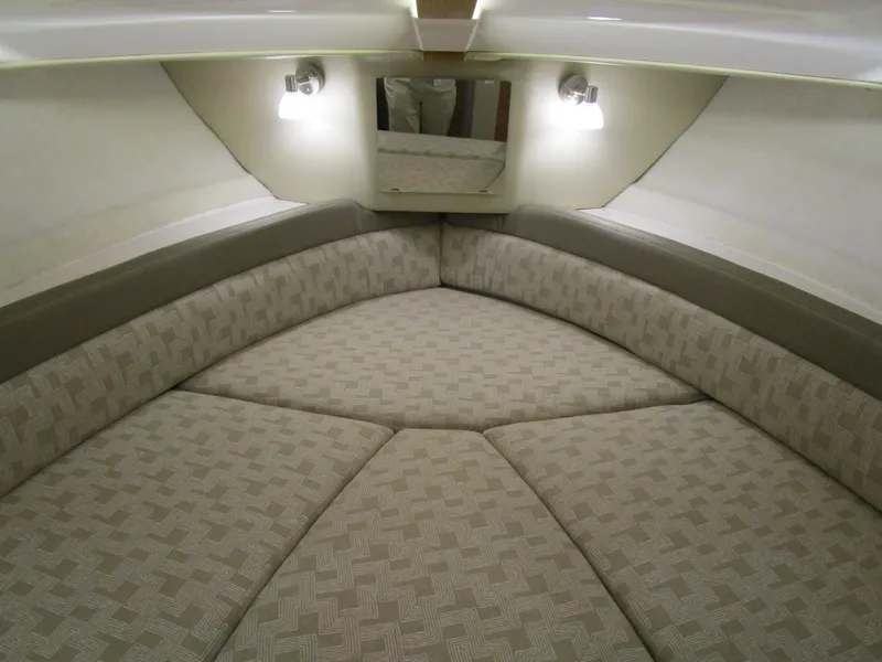 Slide: The Image of 2025 Cutwater C-248 Coupe interior cabin with cushioned seating and ambient lighting. - 32