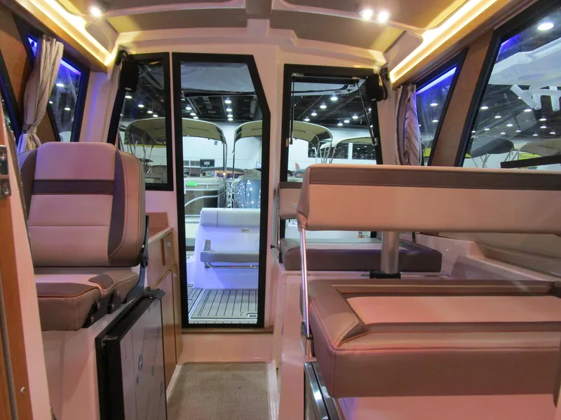 Slide: The Image of Interior of 2025 Cutwater C-248 Coupe boat, featuring modern seating and ambient lighting. - 33