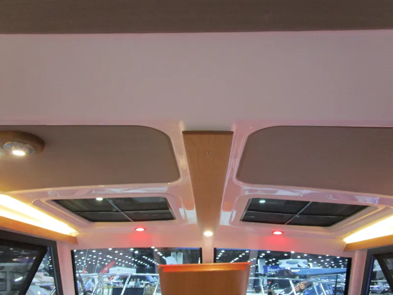 Slide: The Image of Interior view of 2025 Cutwater C-248 Coupe with modern lighting and sunroof. - 36
