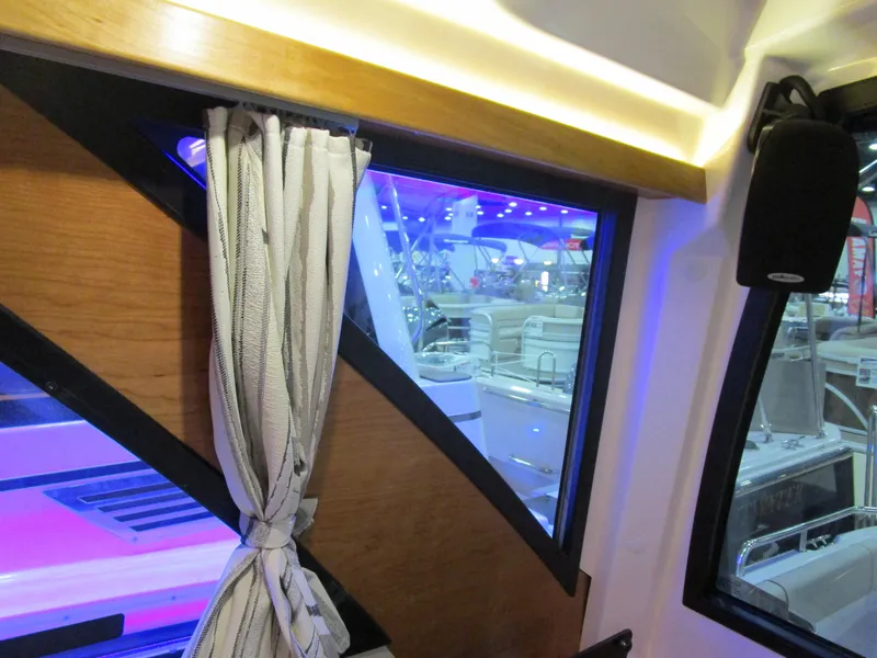 Slide: The Image of Interior view of 2025 Cutwater C-248 Coupe with window and curtain detail. - 37