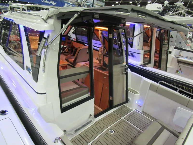Slide: The Image of 2025 Cutwater C-248 Coupe interior view with modern design and seating area. - 4