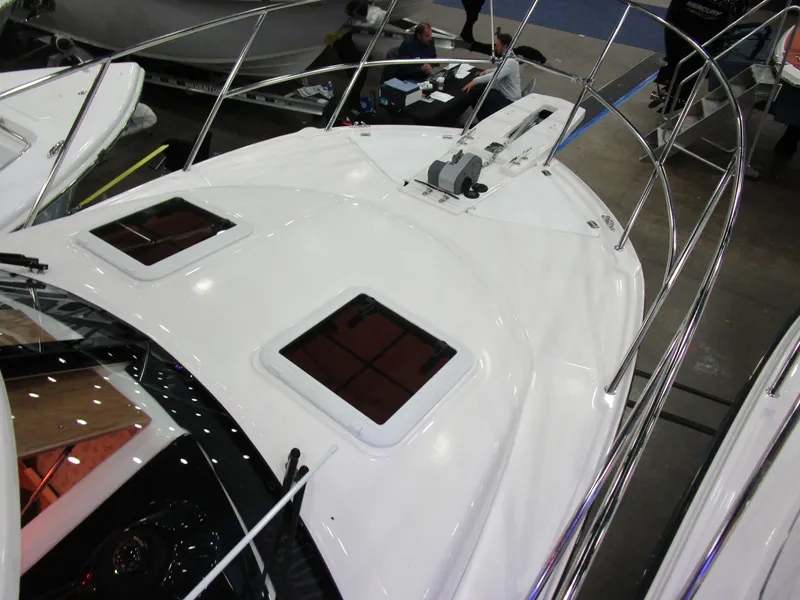 Slide: The Image of 2025 Cutwater C-248 Coupe boat deck with sleek design and dual hatches. - 40