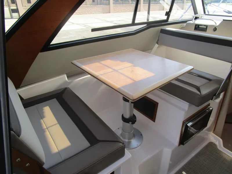 Slide: The Image of 2025 Cutwater C-248 Coupe interior with dining area and modern seating. - 49