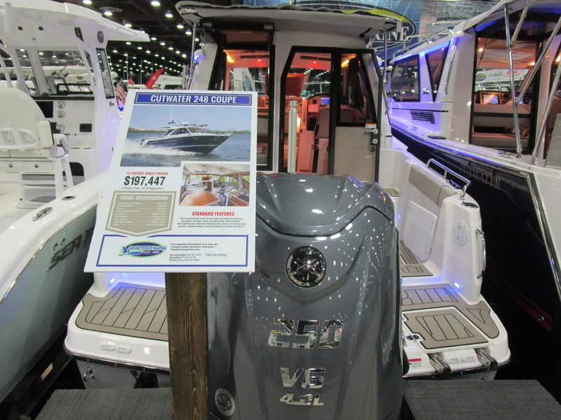 Slide: The Image of 2025 Cutwater C-248 Coupe boat displayed at a show, featuring a 250 V6 engine. - 5