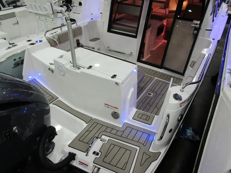 Slide: The Image of 2025 Cutwater C-248 Coupe boat interior with modern design and ambient lighting. - 8
