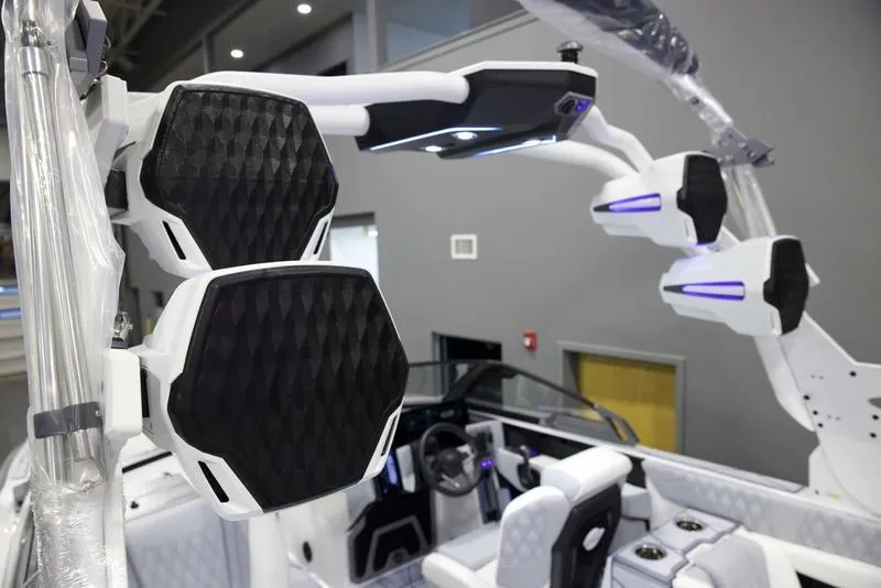 Slide: The Image of 2025 Malibu M242 boat interior with advanced audio system and modern design features. - 12