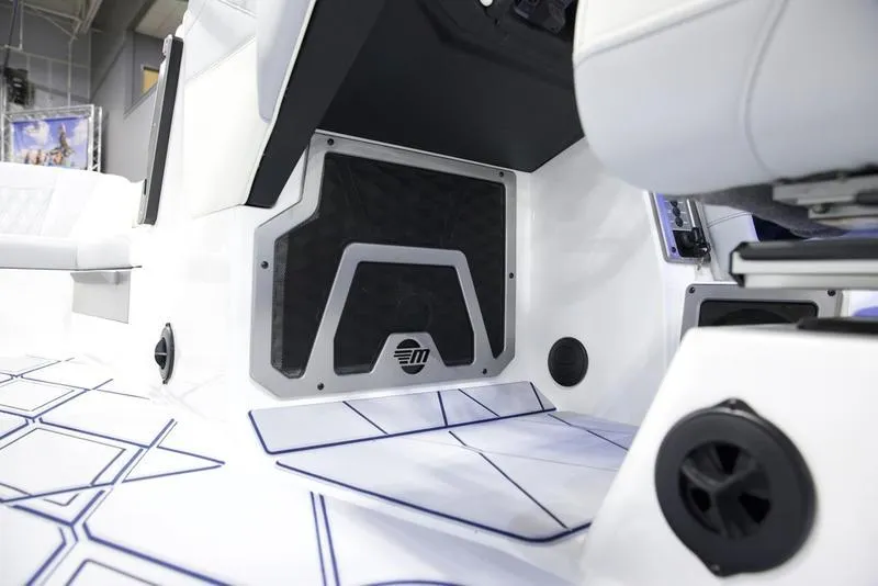 Slide: The Image of Interior of 2025 Malibu M242 boat showcasing sleek design and modern features. - 15