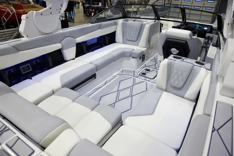 Slide: The Image of 2025 Malibu M242 boat interior with luxurious seating and modern design. - 17