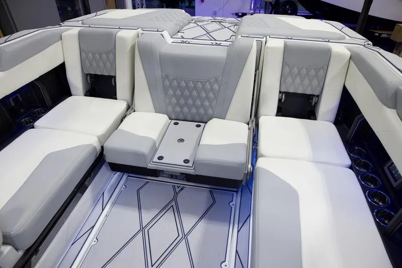 Slide: The Image of 2025 Malibu M242 boat interior with luxurious seating and modern design. - 23