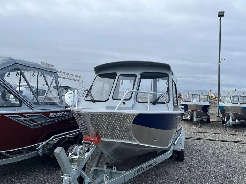 Slide: The Image of 2024 Hewescraft 200 ProV ET HT boat on trailer, displayed outdoors. - 2