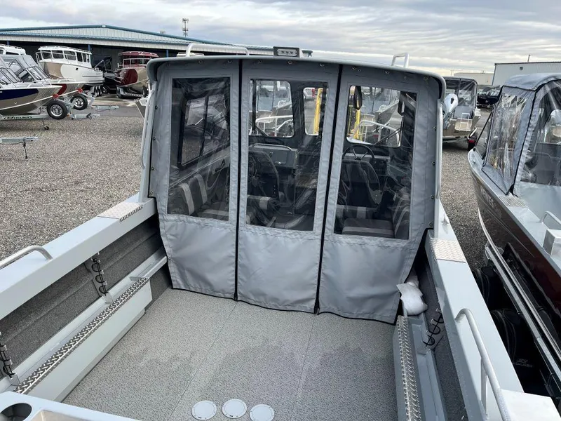 Slide: The Image of 2024 Hewescraft 200 ProV ET HT boat interior with covered cabin and spacious deck. - 4