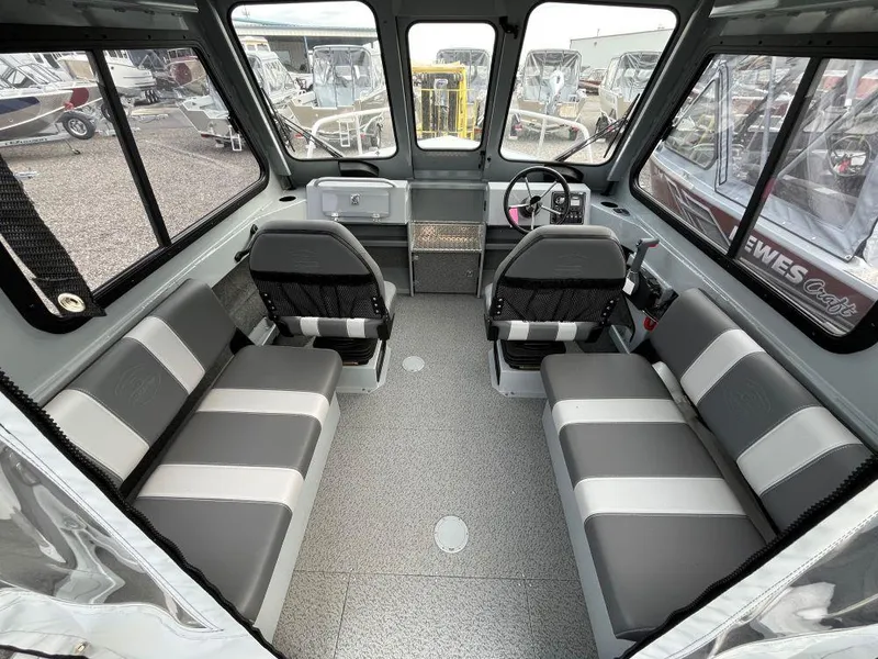 Slide: The Image of 2024 Hewescraft 200 ProV ET HT boat interior with seating and steering console. - 5