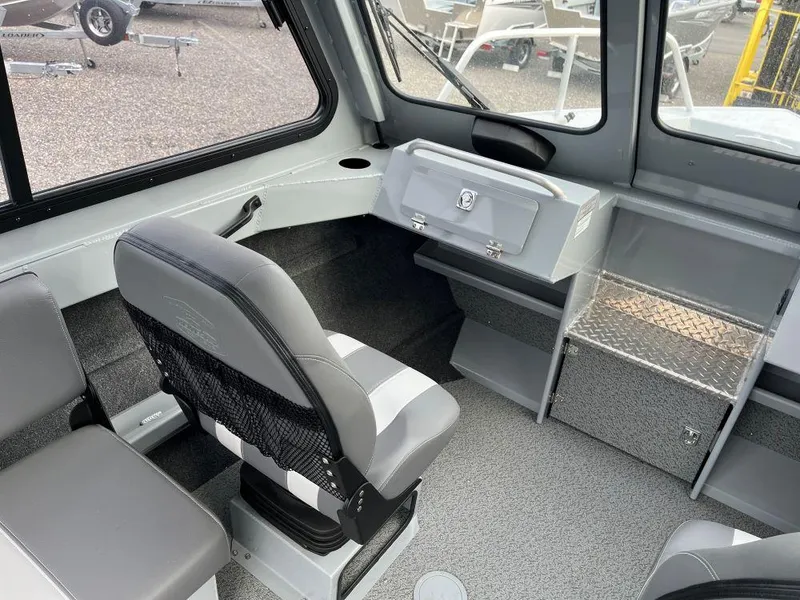 Slide: The Image of 2024 Hewescraft 200 ProV ET HT boat interior with seating and storage compartments. - 7