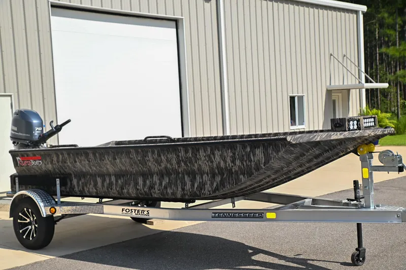 The Image of 2024 Reaper Boats TIMBER REAPER 756 on trailer, parked outside a building. - 0