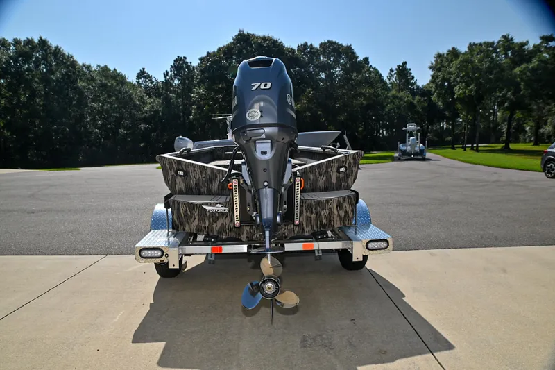 Slide: The Image of 2024 Reaper Boats TIMBER REAPER 756 on trailer, rear view, outdoors, sunny day. - 2