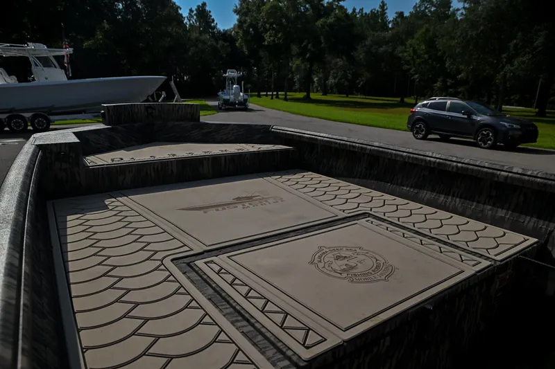 Slide: The Image of 2024 Reaper Boats TIMBER REAPER 756 interior with custom deck design, parked outdoors. - 8