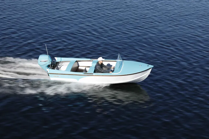 Slide: The Image of 2025 Starcraft 57 SKI CHAMP boat cruising on calm blue water. - 4