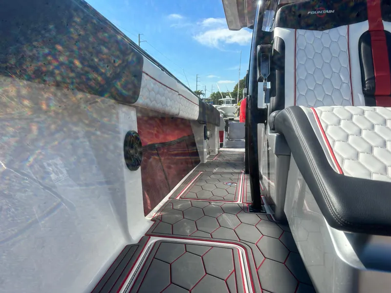 Slide: The Image of 2021 Fountain 38SC boat interior with hexagonal pattern seats and flooring. - 15