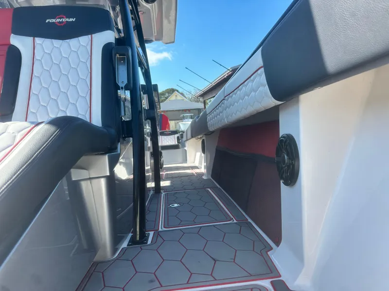 Slide: The Image of 2021 Fountain 38SC boat interior with hexagonal flooring and stylish seating. - 16