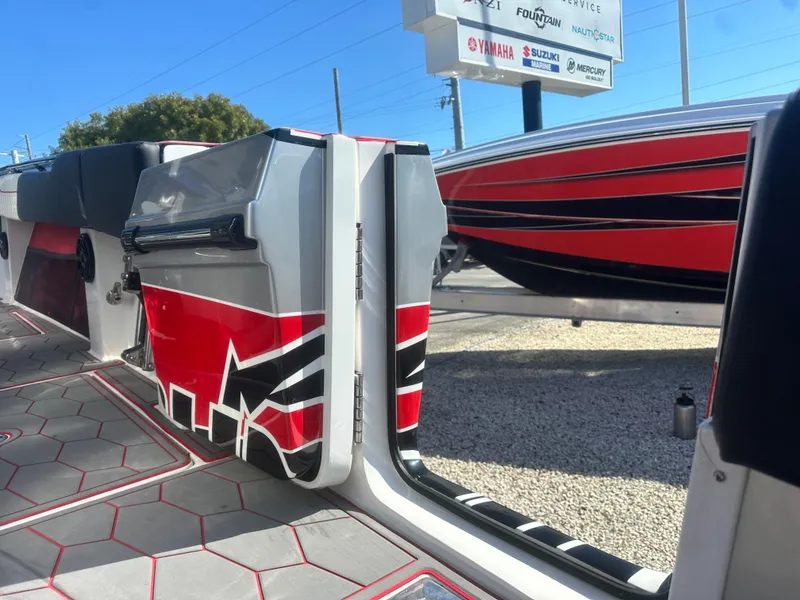 Slide: The Image of 2021 Fountain 38SC boat interior with red and black design accents. - 19