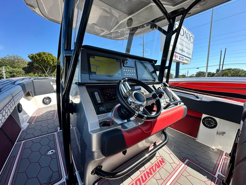 Slide: The Image of 2021 Fountain 38SC boat interior with modern dashboard and steering wheel. - 28