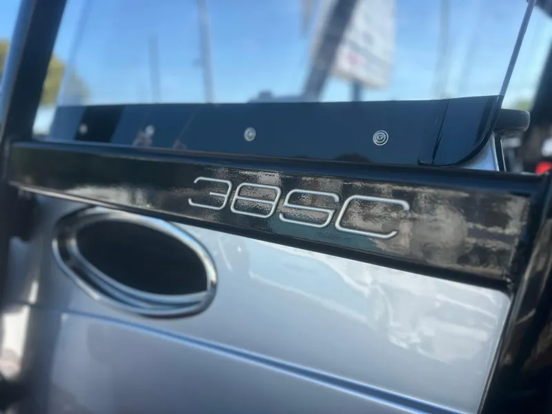 Slide: The Image of 2021 Fountain 38SC boat emblem with sleek design and reflective surface. - 34