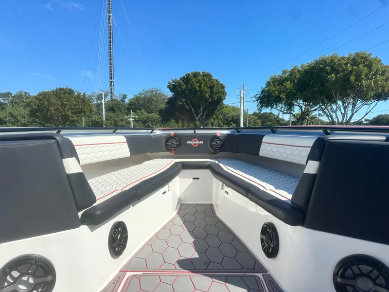 Slide: The Image of 2021 Fountain 38SC boat interior with hexagonal pattern seating and speakers. - 35