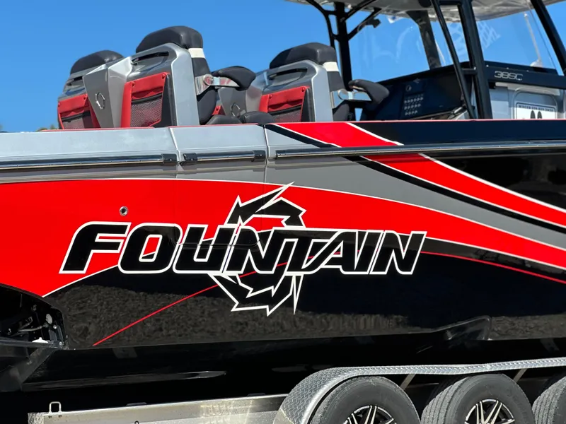 Slide: The Image of 2021 Fountain 38SC boat with bold red and black design on trailer. - 5