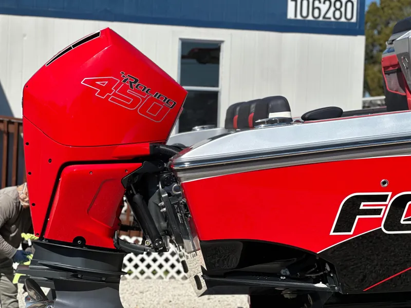 Slide: The Image of Red 2021 Fountain 38SC boat with Mercury Racing 450 engine, parked outdoors. - 7