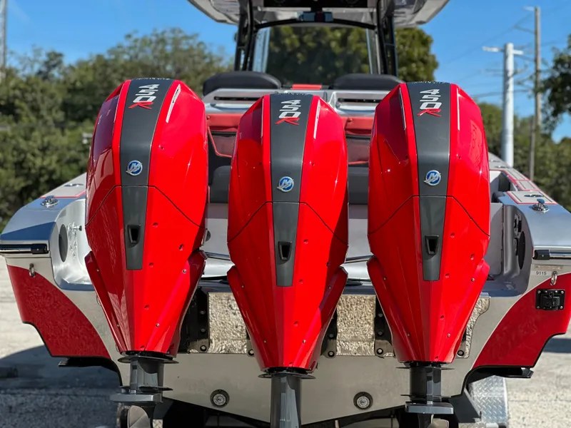 Slide: The Image of 2021 Fountain 38SC boat with three red outboard engines. - 9