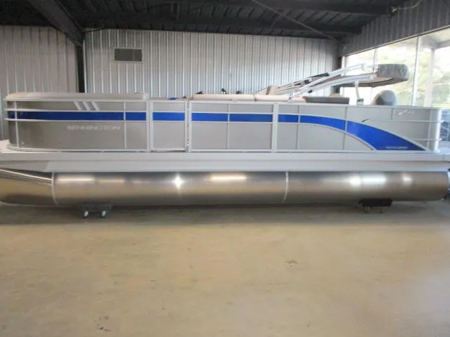 Slide: The Image of 2025 Bennington 23SXS STERN FISH pontoon boat in a showroom. - 1