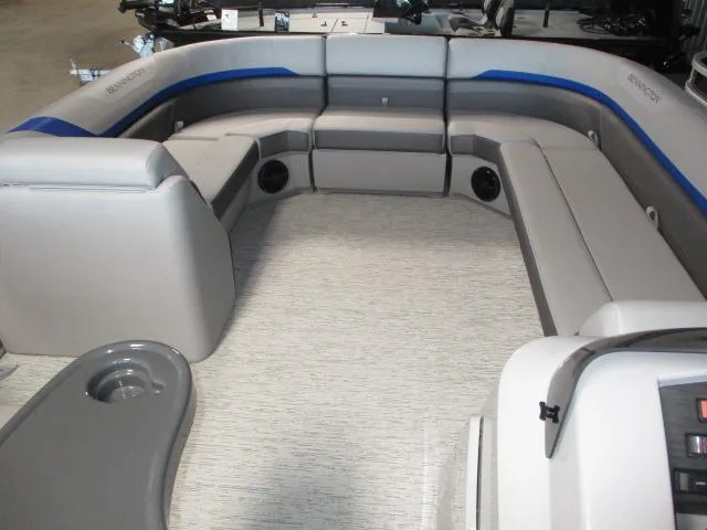 Slide: The Image of 2025 Bennington 23SXS STERN FISH boat interior with gray seating and modern design. - 3