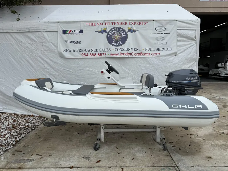The Image of 2025 Gala A300Q inflatable boat with Yamaha motor displayed outdoors. - 0