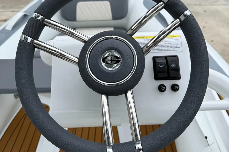 Slide: The Image of Steering wheel of 2025 Gala A300Q boat, featuring sleek design and control panel. - 11