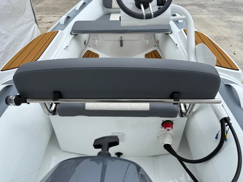 Slide: The Image of 2025 Gala A300Q boat interior with steering wheel and seating. - 2