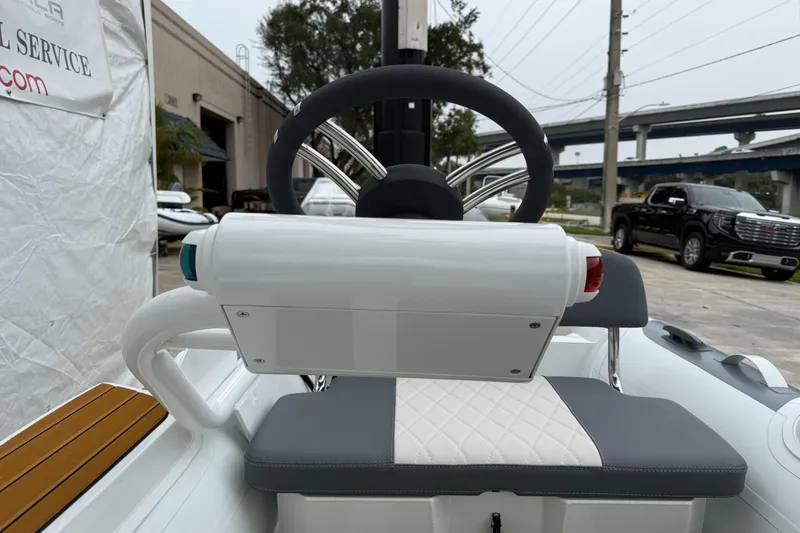Slide: The Image of Steering console of 2025 Gala A300Q boat, featuring modern design and comfortable seating. - 5