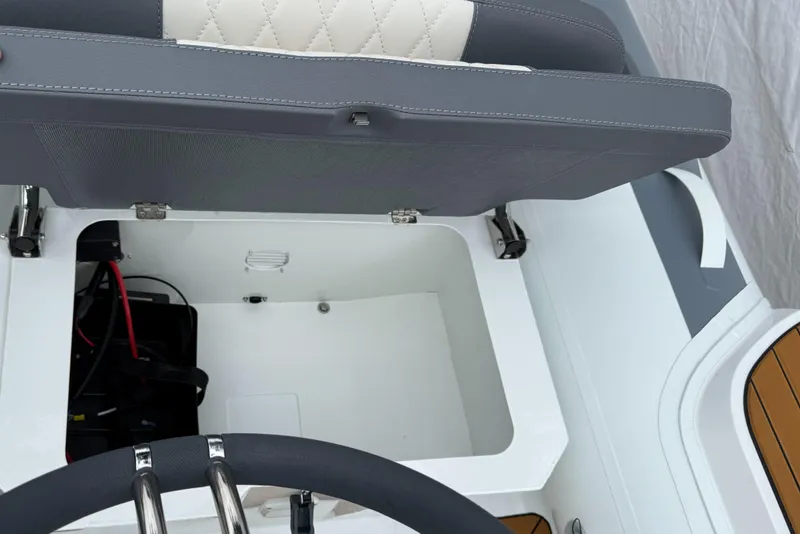 Slide: The Image of Open storage compartment in 2025 Gala A300Q boat with cushioned seat. - 8