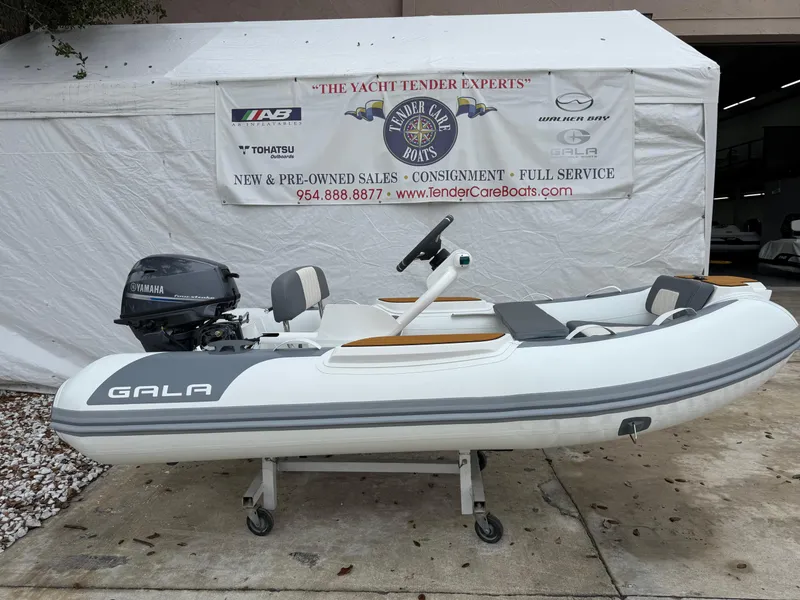 Slide: The Image of 2025 Gala A300Q inflatable boat with Yamaha motor, displayed at a dealership. - 1