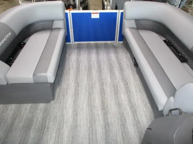 Slide: The Image of 2025 Bennington 20S interior with gray seating and flooring, showcasing spacious design. - 3