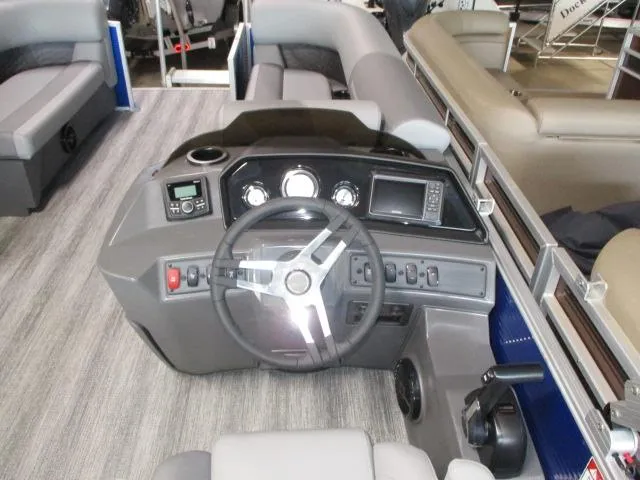 Slide: The Image of 2025 Bennington 20S boat interior with steering console and seating. - 6