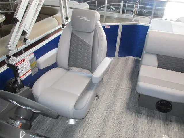 Slide: The Image of 2025 Bennington 20S boat interior with gray captain's chair and seating, featuring modern design. - 7