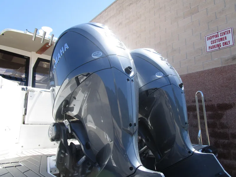 Slide: The Image of 2025 Cutwater C-288 Coupe kitchen with sink, stove, and microwave. - 18