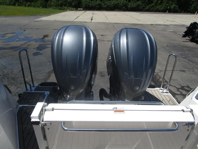 Slide: The Image of Interior of 2025 Cutwater C-288 Coupe featuring a modern kitchen with microwave and stove. - 19